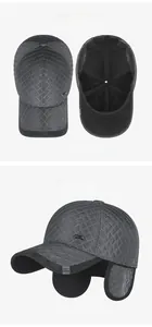 Detailed views of winter baseball cap showing ear flaps and quilted diamond texture