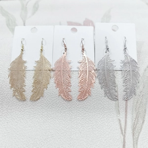 Polished metal feather drop earrings in gold, rose gold and silver finishes