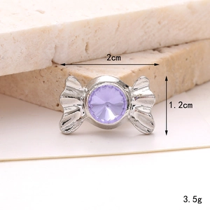 Detailed view of silver candy-shaped shoe charm with purple gem and size dimensions