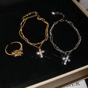 Cross and star zircon bracelets in gold and silver finish on a premium black velvet box