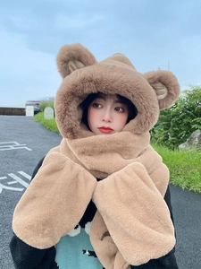 Detail of plush three-in-one hooded scarf with bear ears and M letter embroidery
