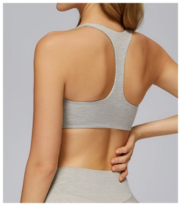 Close-up of racerback sports bra with soft brushed texture and seamless grey finish