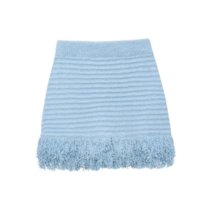 Detail of light blue knit mini skirt featuring textured stripes and tassel fringe hem