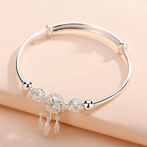 999 Sterling silver dreamcatcher bangle with feather charms and heart engraved beads