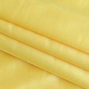 Macro view of bright yellow mesh fabric texture with a layered semi-transparent finish