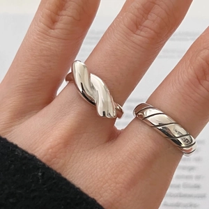 Minimalist 925 sterling silver knotted rings including a thick twist and a slim spiral band