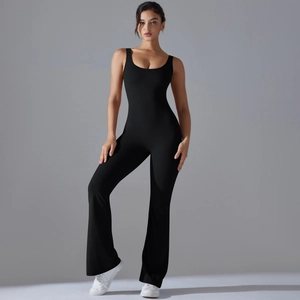 Close-up of black cutout back yoga jumpsuit featuring sleek flared leggings and U-neck design