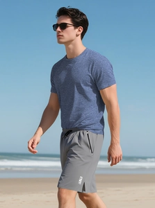 Outdoor shot of blue heather texture sports t-shirt and grey shorts with zipper pockets