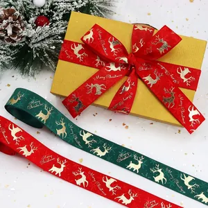 Christmas ribbed ribbons with gold elk patterns and Merry Christmas text on gift boxes