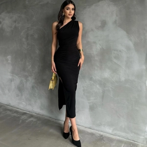 Detail of black one-shoulder dress showing side ruched fabric and high leg slit design