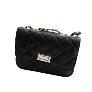 Classic black quilted crossbody bag with pebbled leather texture and chain strap