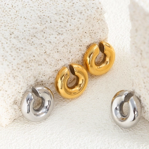 Chic 18k gold and silver C-shaped titanium steel ear cuffs on decorative white stone base