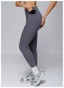 Detail view of high-waisted yoga leggings with side pockets in smoky grey finish