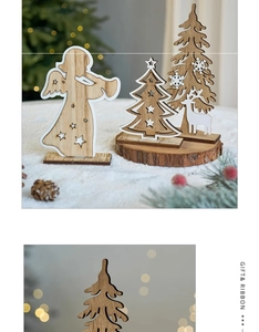 Detail of wooden Christmas tree and angel ornaments on snow with warm festive lighting