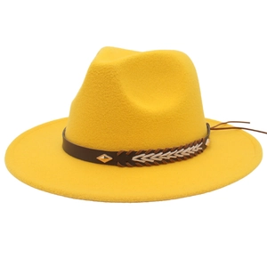 Detail of yellow wool fedora showing brown braided band and diamond metal rivet accent