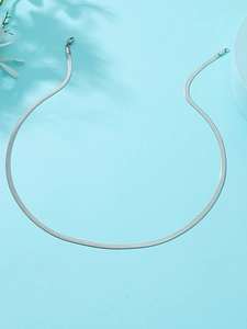 Close-up of a polished silver stainless steel snake chain necklace with lobster clasp