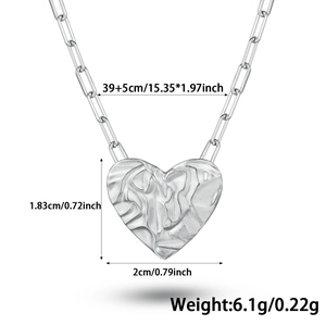 Detail of silver heart pendant with unique pleated texture and size measurements
