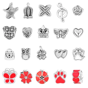 Macro shot of 20 assorted silver metal beads with starfish and heart motifs for DIY bracelets