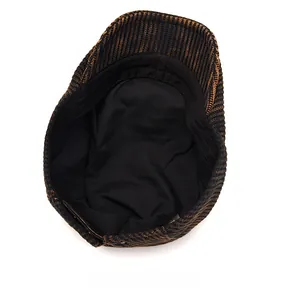 Detail view of the soft black inner lining and smooth stitching of the knitted newsboy cap