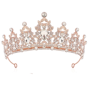 Detailed close-up of rose gold crystal bridal crown with sparkling white rhinestones