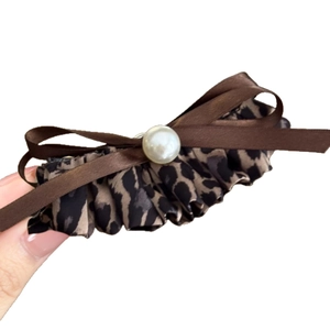 Maillard leopard print bow hair clip with white pearls and brown satin ribbons