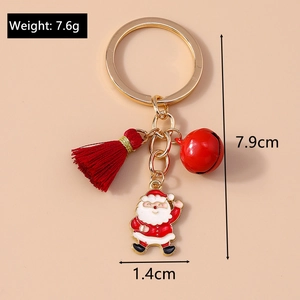 Detail view of Christmas keychain with red tassel, bell, and Santa pendant with dimensions