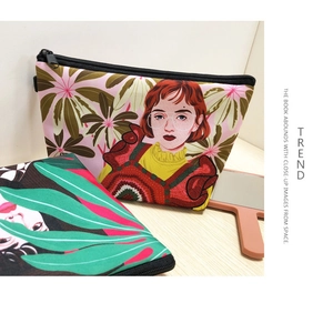 Detailed view of artistic retro female portrait and tropical leaf print on polyester bag