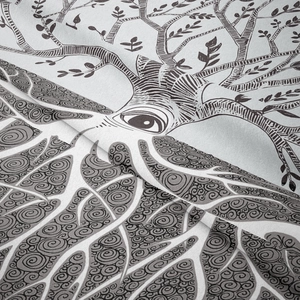 Macro shot of tree of life tapestry showing intricate black weaving and fabric texture