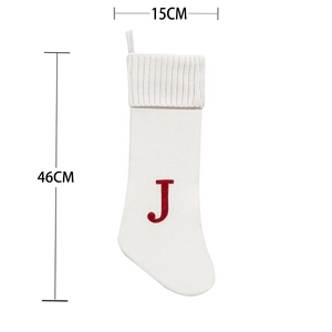 White knitted Christmas stocking with red letter J embroidery and 46cm size markers