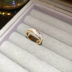 Detail view of 18k gold plated 925 sterling silver stamp and sparkling cubic zirconia stones