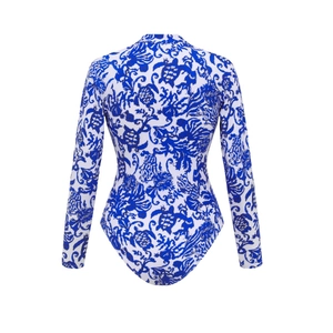 Detail view of the back of a long-sleeve surfing suit with blue ocean life print