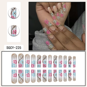 Floral long trapezoid press-on nails with pink flowers and rhinestone chain decor