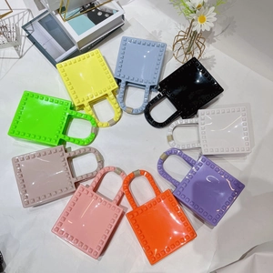 Mini PVC jelly crossbody bags with rivet studs in ten vibrant summer colors