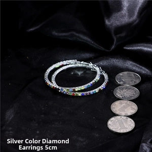 Detailed view of 5cm silver hoop earrings with multicolored gradient rhinestones