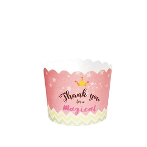 Pink cupcake paper liners with star crown patterns for baking and party decorations