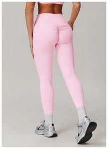 Close-up of pink high waist yoga pants with scrunch butt lifting detail for fitness