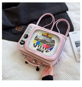 Detail of pink retro TV crossbody bag with transparent PVC screen and rainbow signal print