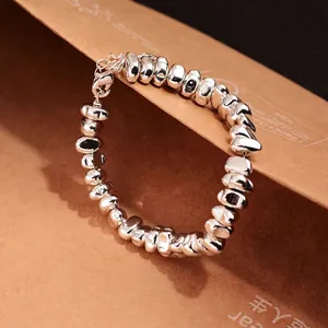 Irregular silver geometric beaded bracelet with lobster clasp and adjustable chain