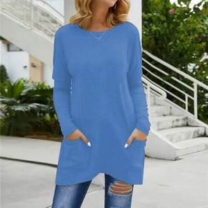 Detail shot of the functional side pockets on a casual blue long sleeve tunic top