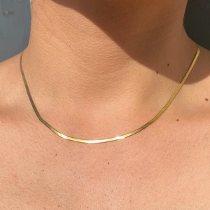 Elegant gold flat snake bone chain necklace made of polished stainless steel for women