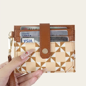 Brown geometric windmill print card holder with RFID protection and wrist strap