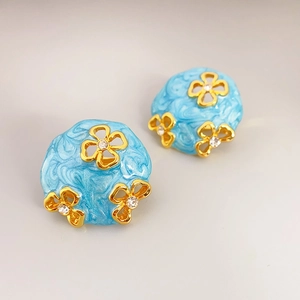 French vintage light blue enamel earrings with gold hollow flowers and rhinestones