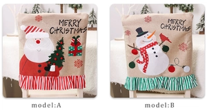 Detail of Christmas chair covers with Santa and Snowman motifs in linen with ruffles