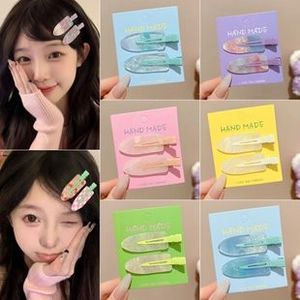 Detail of Korean macaron colored hair clips in pink and blue for various hairstyles