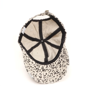 Close-up of leopard print baseball cap interior featuring cotton lining and frayed edges