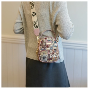 Rear view of a floral printed beige crossbody bag with pink trim and wide logo strap