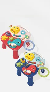 Macro detail of ocean-themed baby game table with musical piano keys and clock