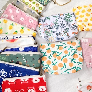 Mini floral canvas coin purses with cute cartoon prints and zipper closures