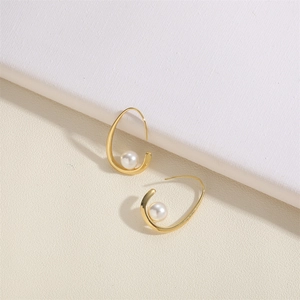 Artistic gold-plated hoop earrings with irregular ABS pearls in a minimalist C-shape