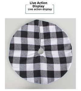 Detailed view of classic black and white buffalo plaid Christmas tree skirt with thick texture